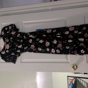 Dark floral romper dress with a high low style